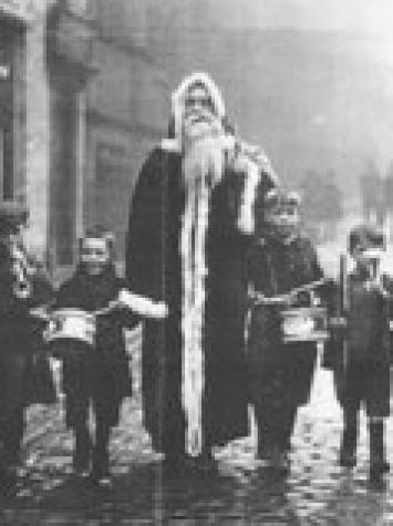 De Engelse Christmas Father met kinderen. 