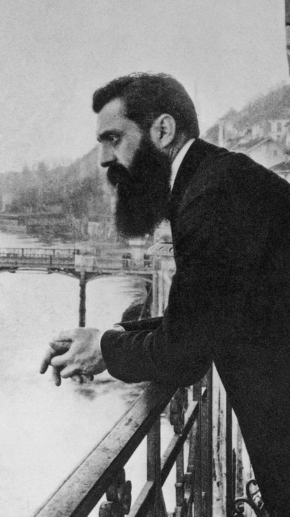 zwart-witfoto van Theodor Herzl die naar het water kijkt in Wenen